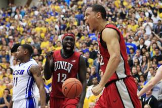 UNLV's Chace Stanback and Brice Massamba celebrate a basket and foul against UC Santa Barbara Wednesday, Nov. 30, 2011 in Santa Barbara. UNLV won the game in double overtime 94-88.